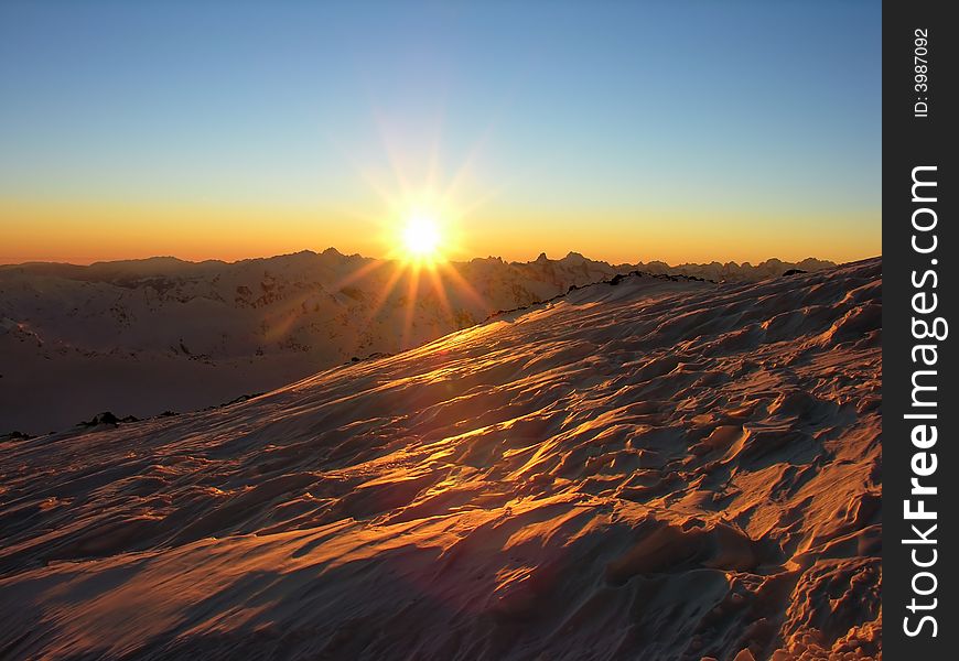 Sunset in snow-covered mountains of Caucasus. Sunset in snow-covered mountains of Caucasus