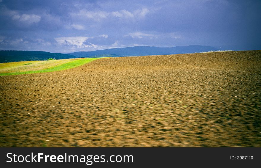 Agriculture field under incoming storm
