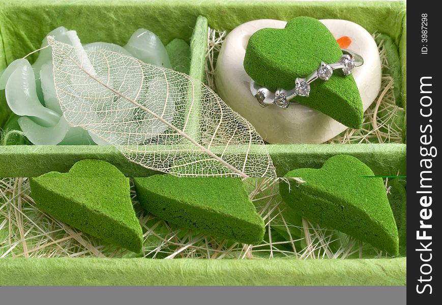 Green color's gift a set of aromas in the form of heart with diamond ring. Green color's gift a set of aromas in the form of heart with diamond ring