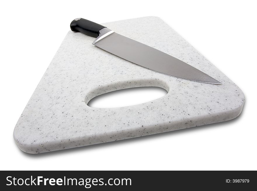 Large Knife on a White Cutting Board. Large Knife on a White Cutting Board