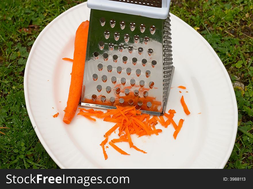 Grated carrot on a white plate