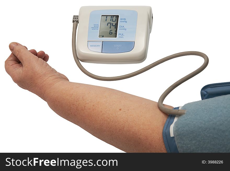 Digital blood pressure monitor on a white background