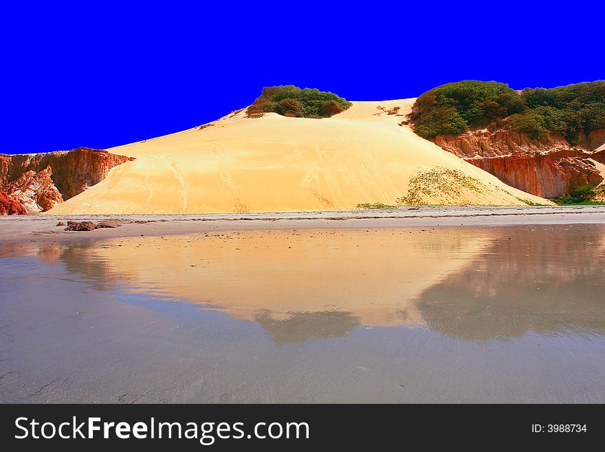 Coastal view with a dune reflected