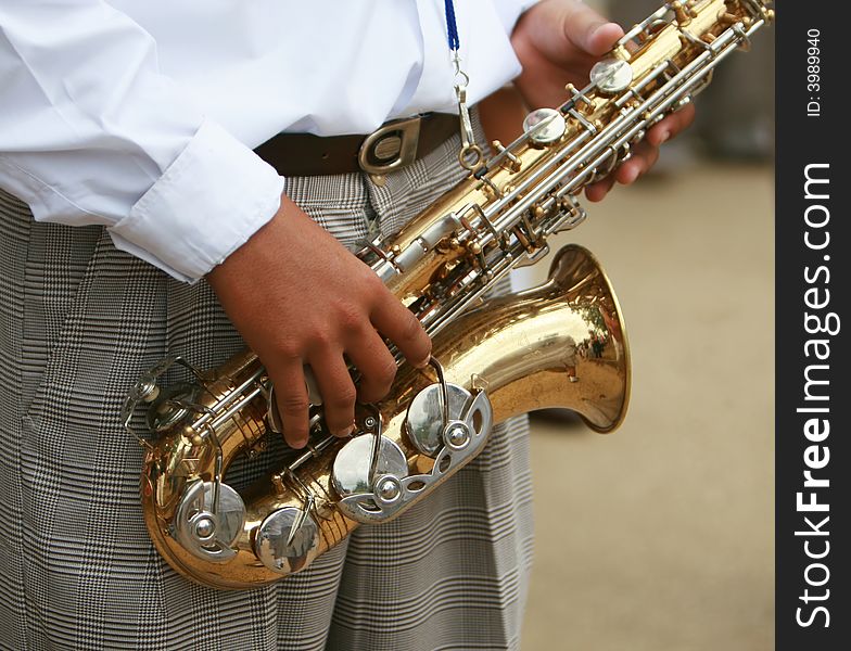 A saxaphone player in a marching band. A saxaphone player in a marching band