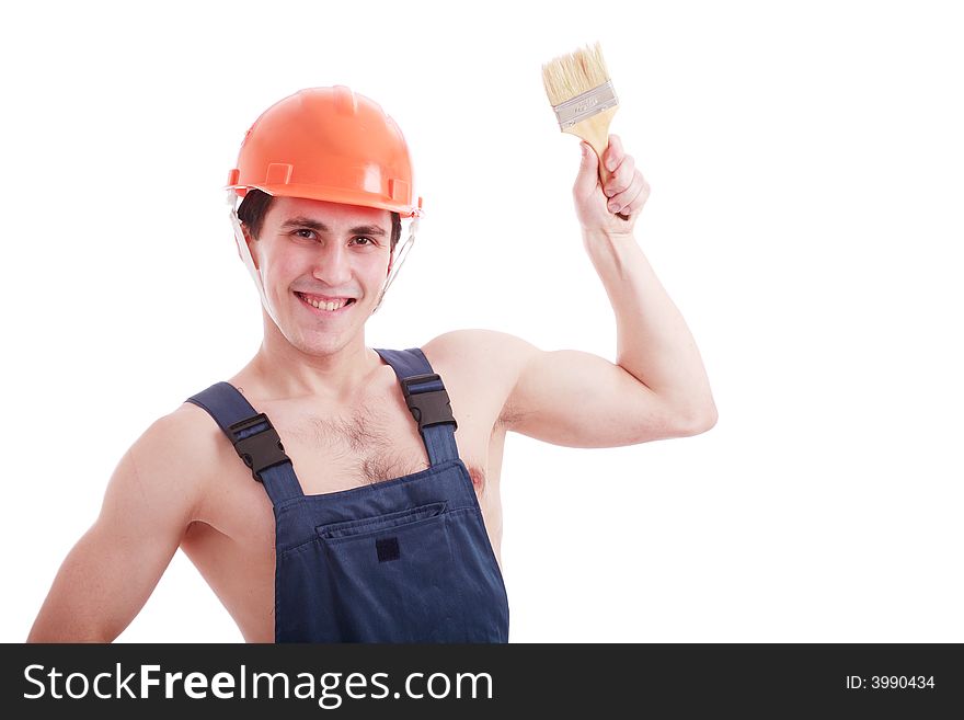 Muscular young man in a builder uniform with tools. Muscular young man in a builder uniform with tools.