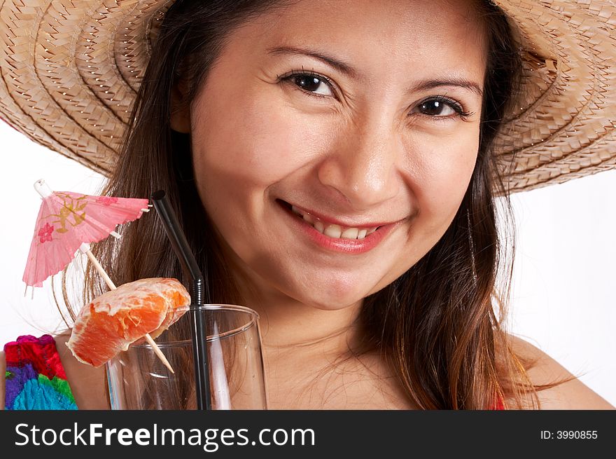A woman wearing a hat and holding a cocktail drink. A woman wearing a hat and holding a cocktail drink