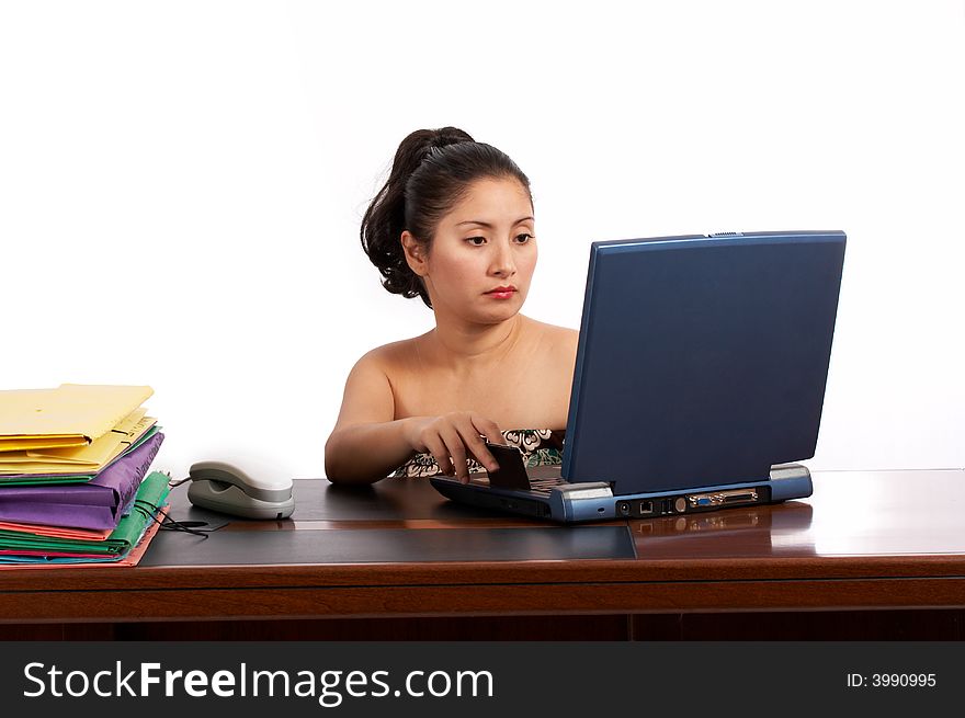 Attractive businesswoman working on a laptop computer