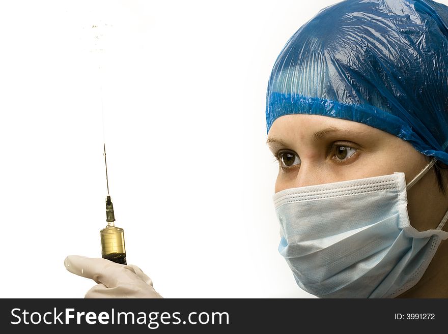 Woman doctors face with splashing syringe. Woman doctors face with splashing syringe