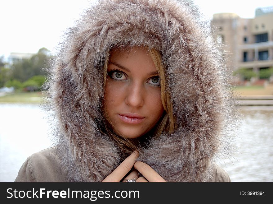 Beautiful confident fashionable woman in a fur jacket. Beautiful confident fashionable woman in a fur jacket