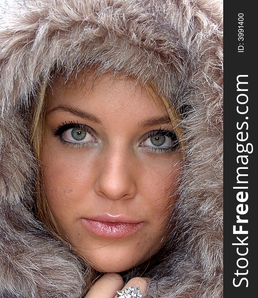 Beautiful confident fashionable woman in a fur jacket. Beautiful confident fashionable woman in a fur jacket