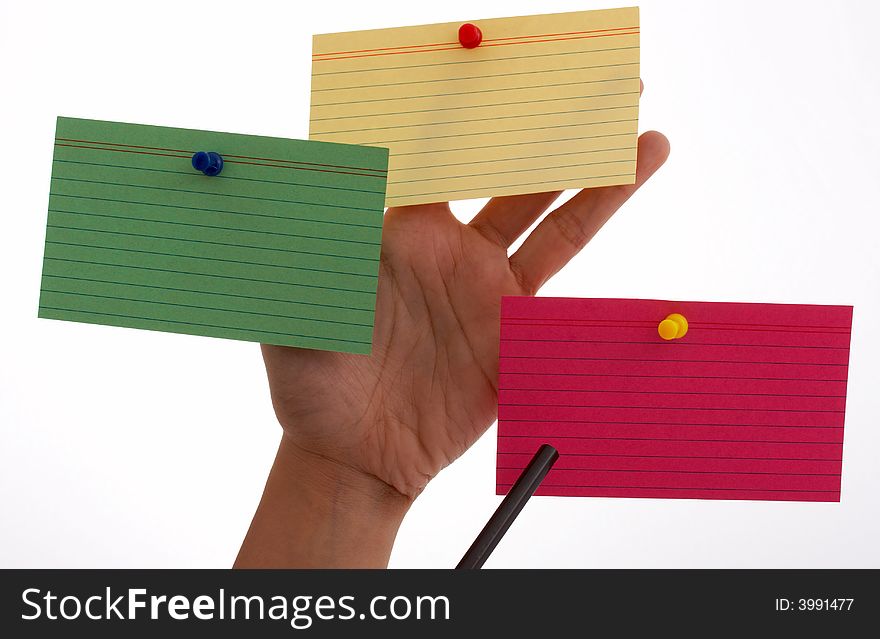 Three blank cards pinned on a hand
