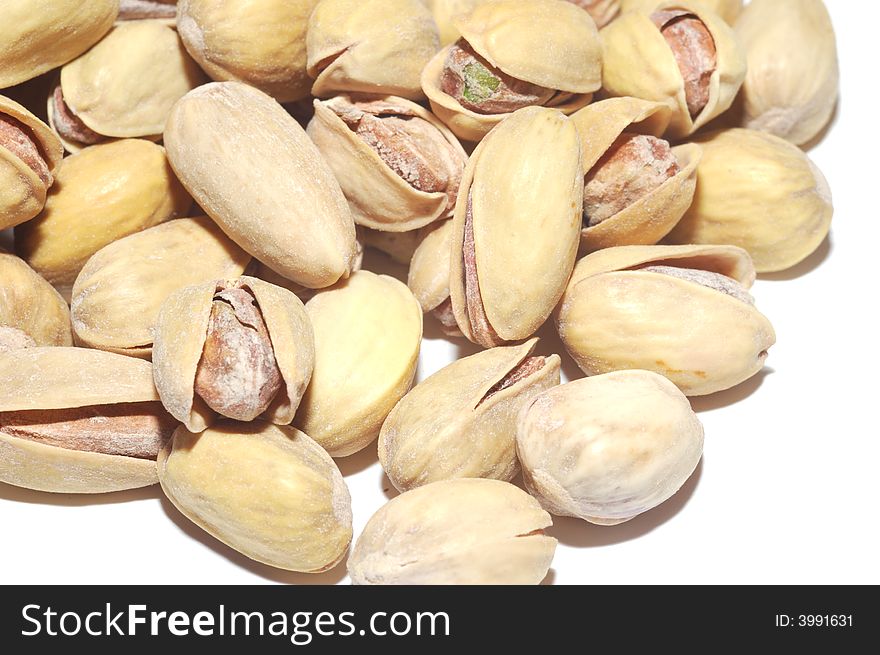 Pistachios close-up isolated on white