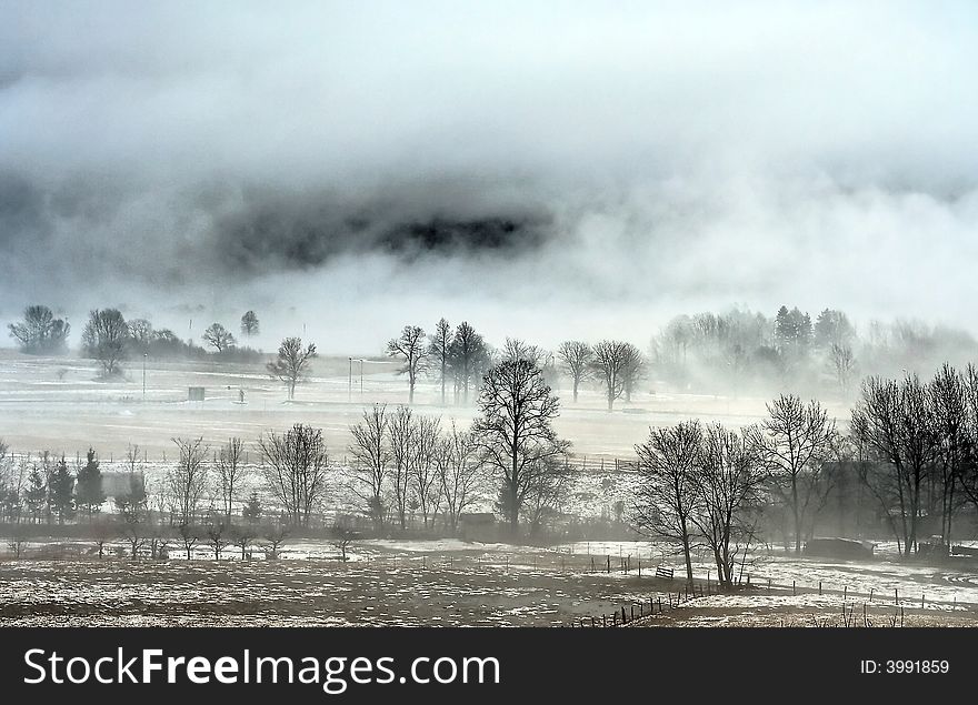Alpine valley in fog and snow. Alpine valley in fog and snow