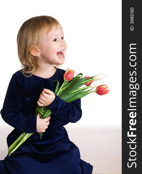 Little girl holds beautiful tulips. Little girl holds beautiful tulips