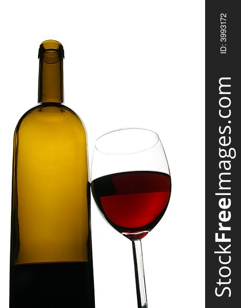 Glass and bottle of red wine isolated over white background