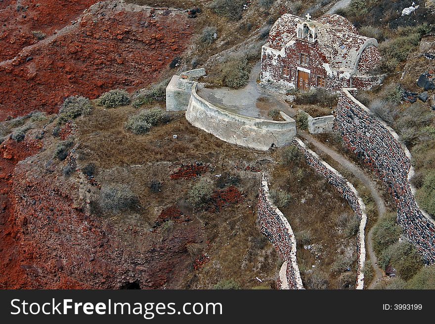 Ancient red brick church perched on cliffside on island of Santorini, Greece. Ancient red brick church perched on cliffside on island of Santorini, Greece