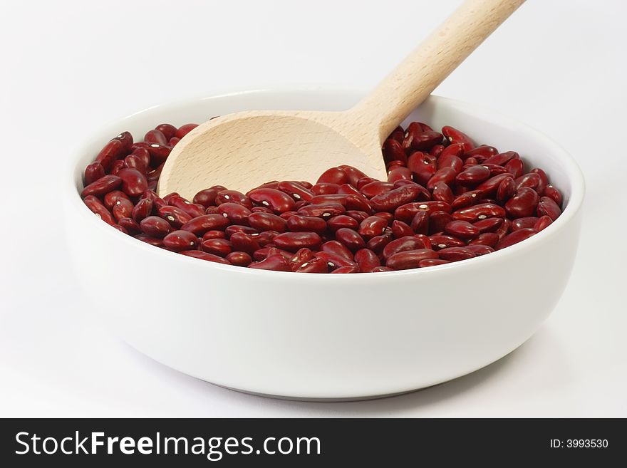 Red Kidney Beans in a white bowl on bright Background