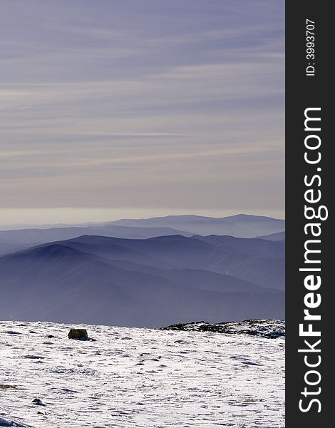 Sunset from one mountain top with snow. Sunset from one mountain top with snow