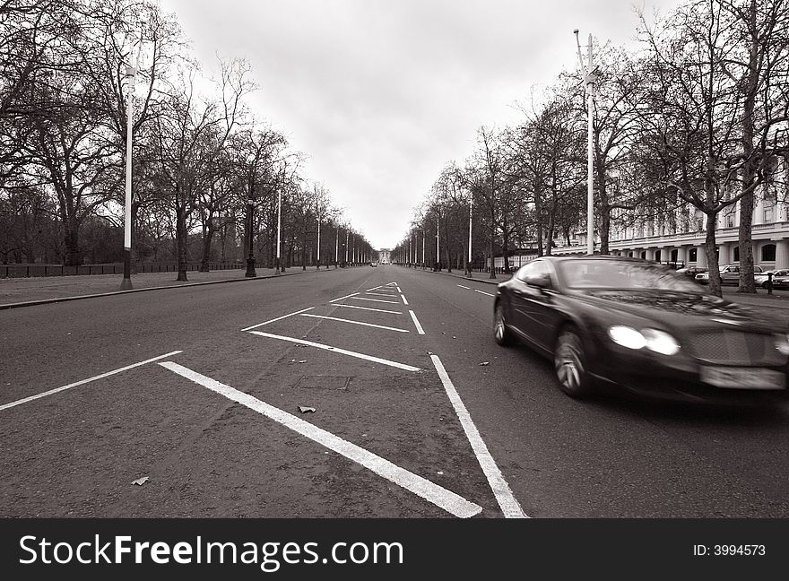 The Mall in London, with a car speeding by. The Mall in London, with a car speeding by