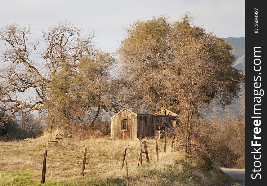 An old abandoned shack in the mountains during winter. An old abandoned shack in the mountains during winter.