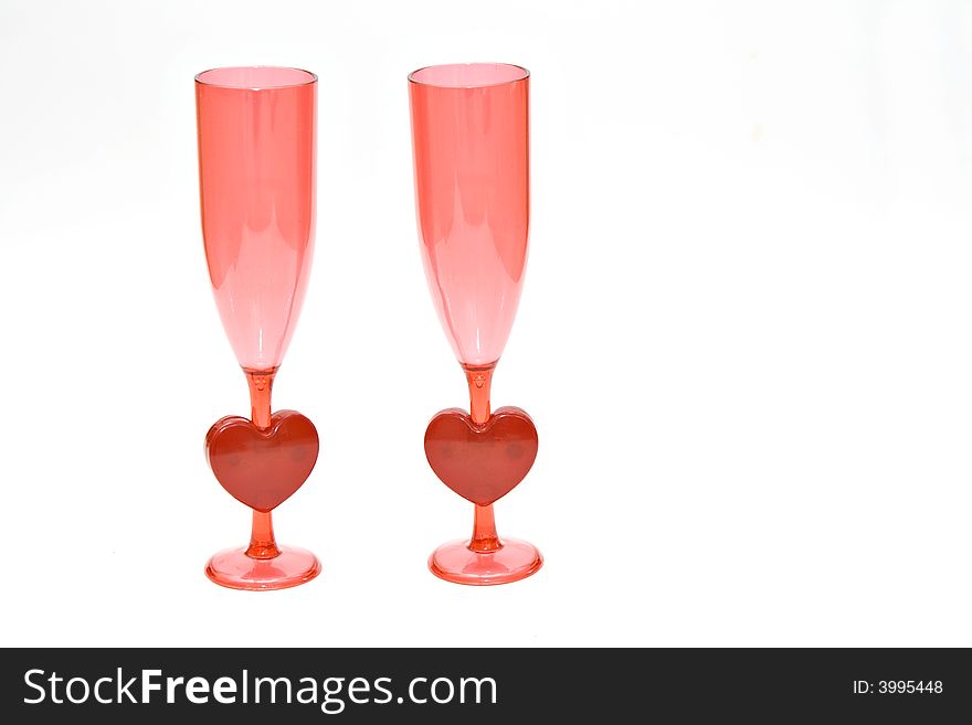 A pair of pink and red champagne glasses - valentines, weddings, engagement, celebrations of love. A pair of pink and red champagne glasses - valentines, weddings, engagement, celebrations of love.