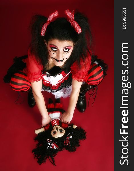 Beautiful young Middle Eastern woman dressed as goth doll. Beautiful young Middle Eastern woman dressed as goth doll.