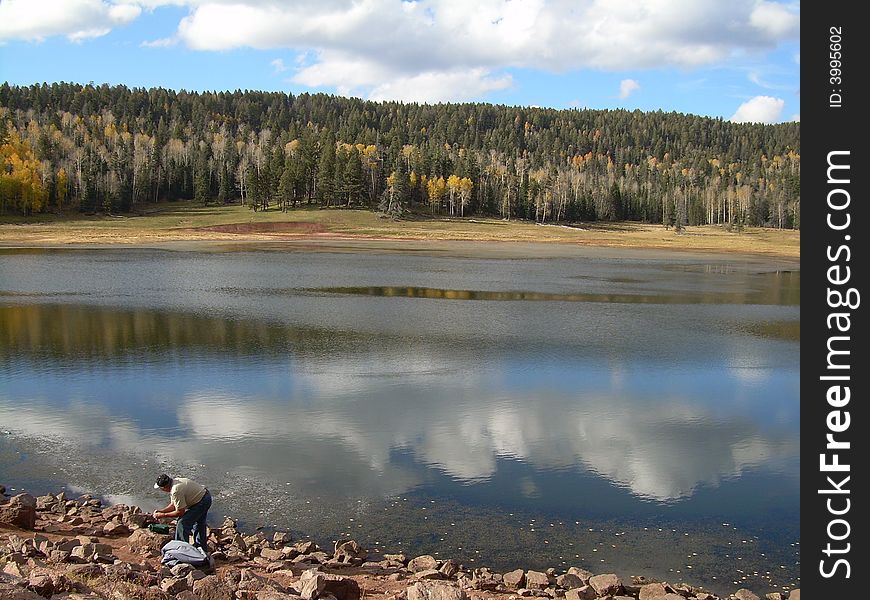 My father baiting hook at small lake near Jemez wilderness, NM. My father baiting hook at small lake near Jemez wilderness, NM