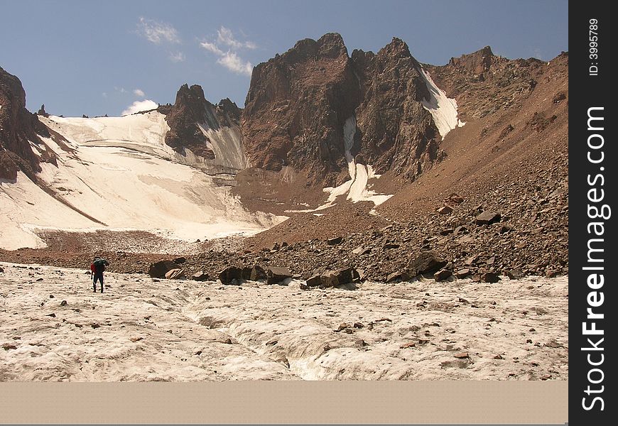 A little figure of climber moving on glacier. A little figure of climber moving on glacier