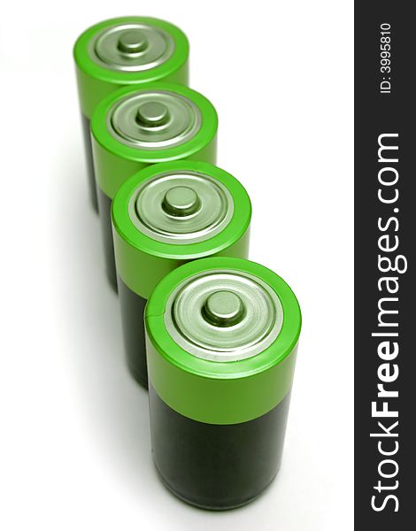 Four green batteries on white background.