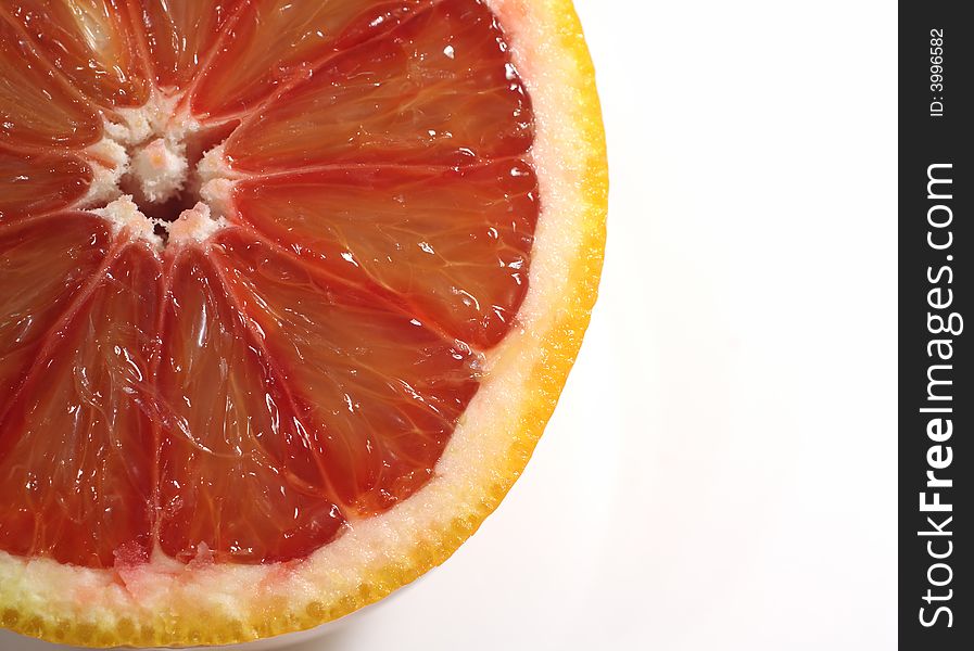 Closeup of a halved blood orange; a fruit that is in season in the winter.