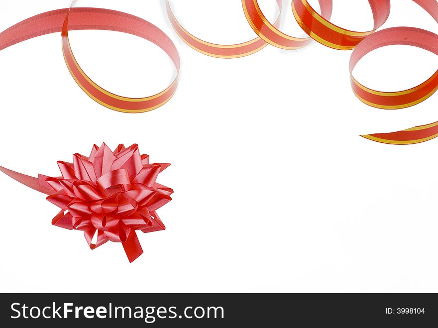 Red gift ribbon with golden stripes isolated on a white background. Red gift ribbon with golden stripes isolated on a white background.