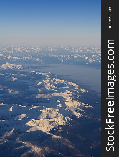 Mountain peaks shoot from plane