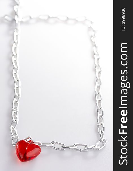 Heart with a chain made in the form of a frame leaving in a distance. Heart with a chain made in the form of a frame leaving in a distance