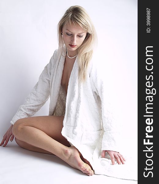Young Sexual Lady In Robe Sitting