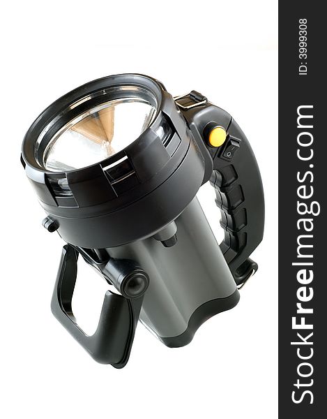 Large plastic halogen flashlight on a white background