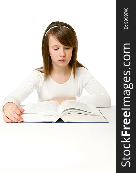 Portrait of Happy young schoolgirl reading book