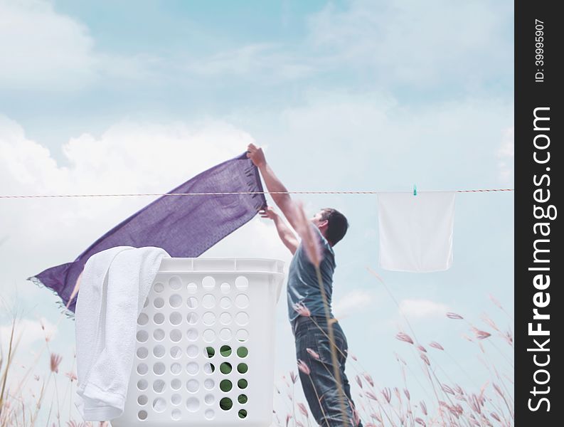 Man With Laundry Background Concept