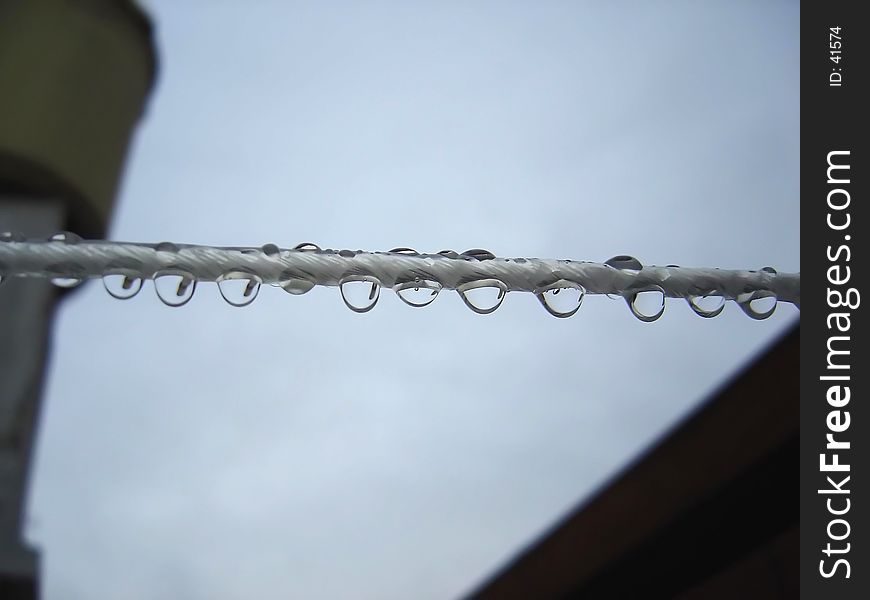 Rain drops put on a cord to hang clothes. Rain drops put on a cord to hang clothes.