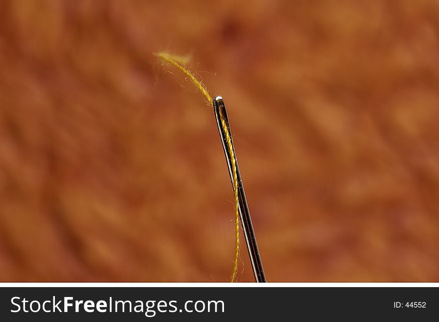 Macro Photo of a Threaded Needle. Macro Photo of a Threaded Needle