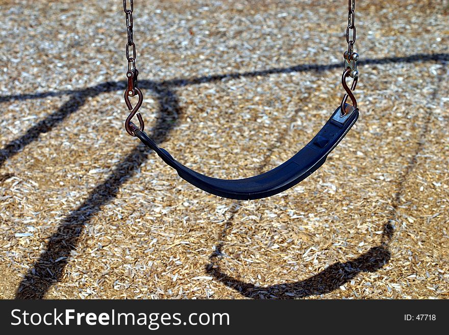 A single empty swing waits for a child to come and play.