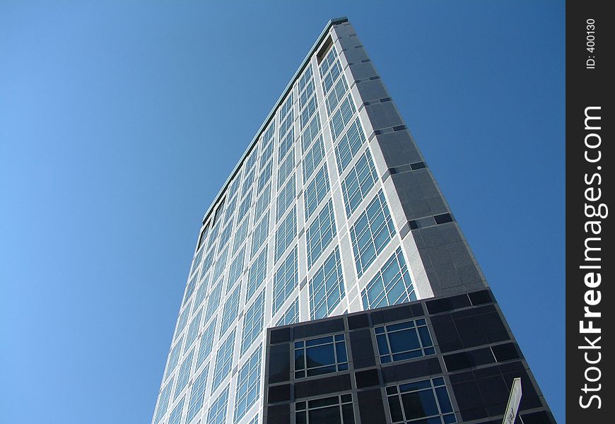 Triangular building against a clear blue sky. Triangular building against a clear blue sky.