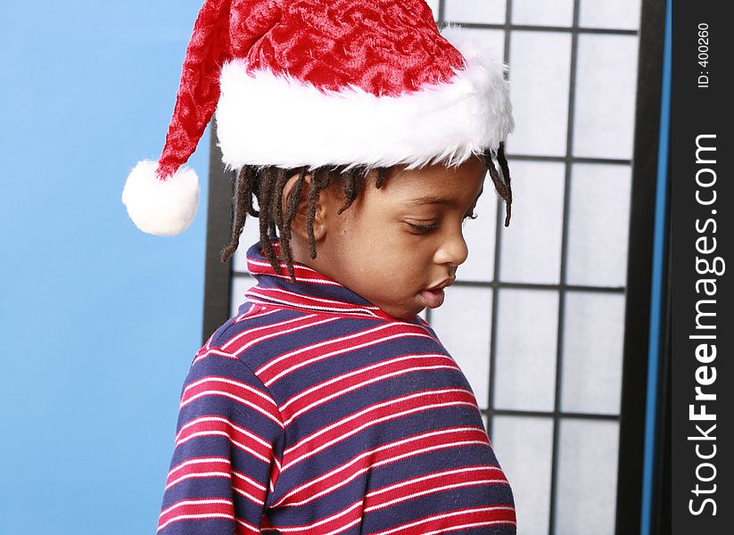 Child in a Santa hat. Child in a Santa hat