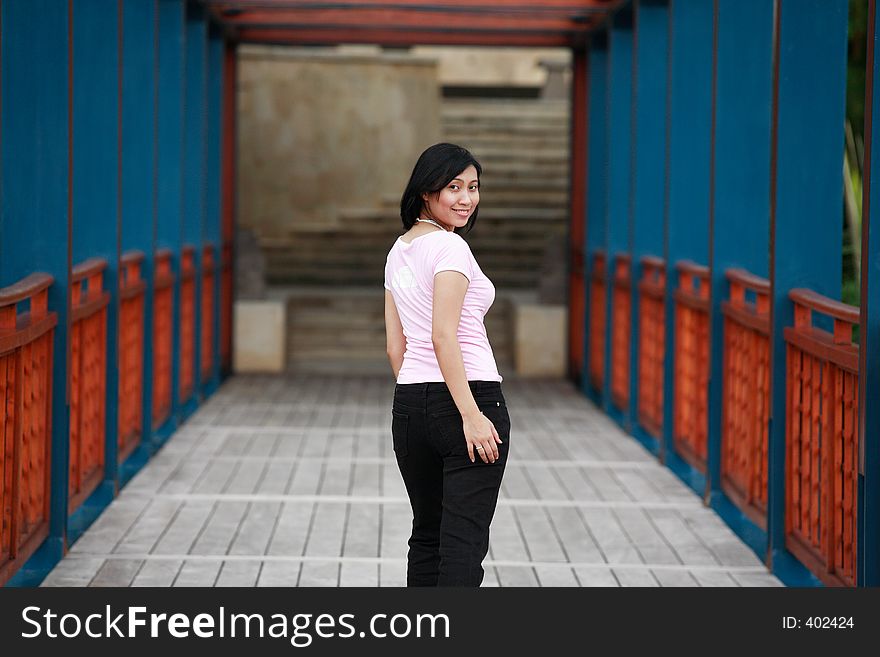 Beautiful Asian woman looking back