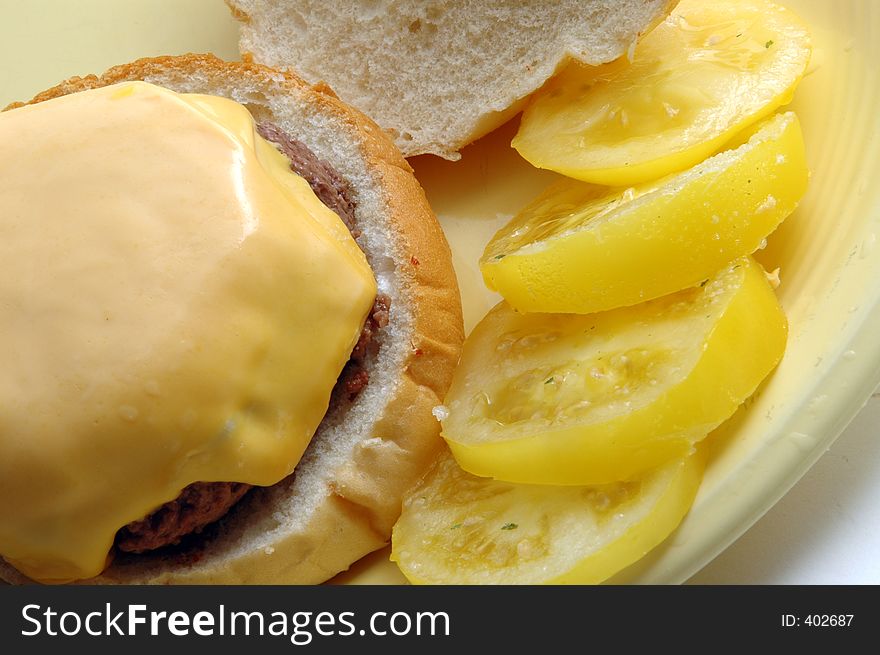 Cheeseburger with yellow tomatoes. Cheeseburger with yellow tomatoes