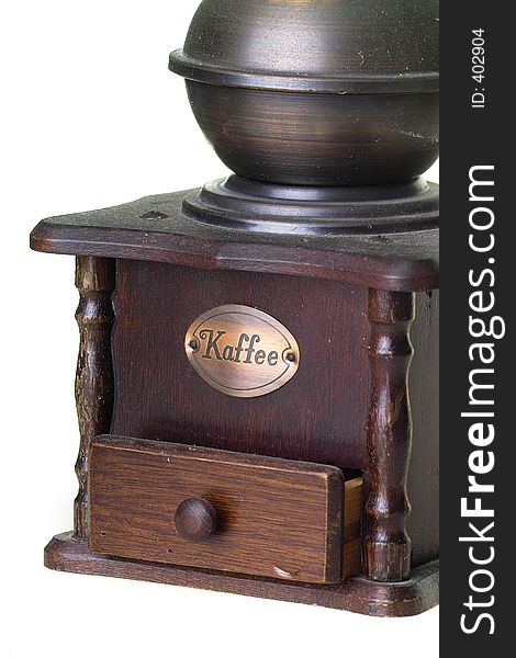 Old brass coffee grinder on white background