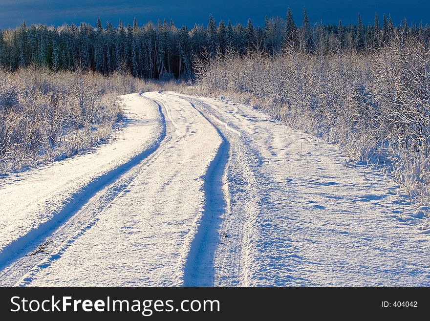 Thick snow covers a backroad in rural Alberta. Thick snow covers a backroad in rural Alberta.