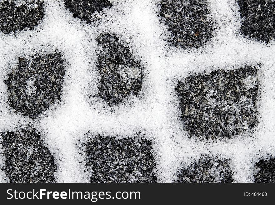 Snowfilled granite pavement gaps make a pattern on the ground. Snowfilled granite pavement gaps make a pattern on the ground