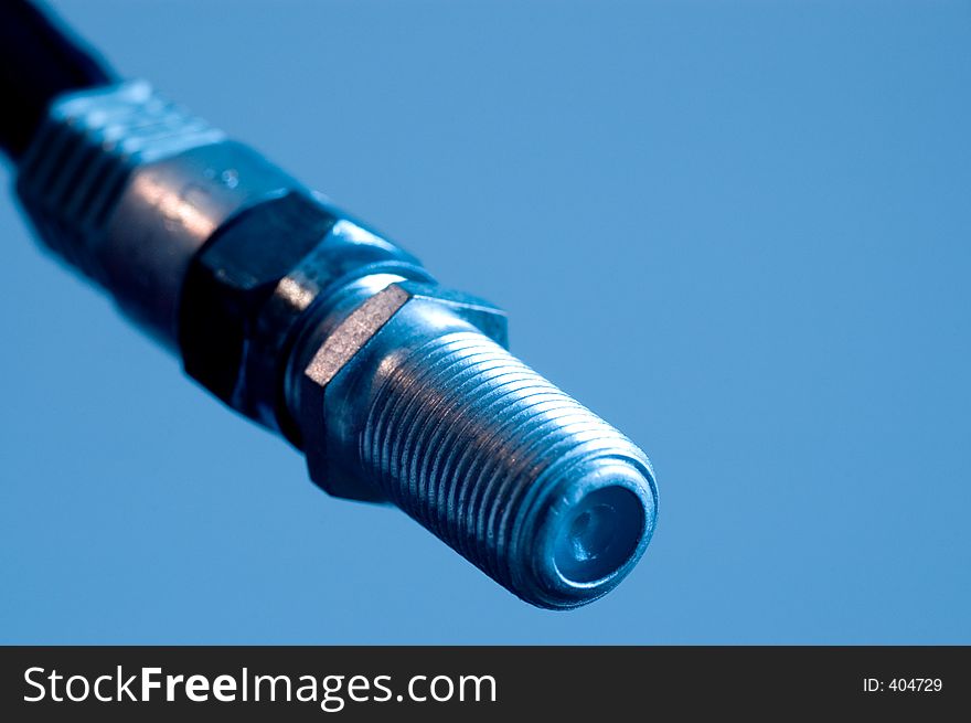 Macro of a coaxial cable connection with a blue tone. Good concept photo for technology. Macro of a coaxial cable connection with a blue tone. Good concept photo for technology.