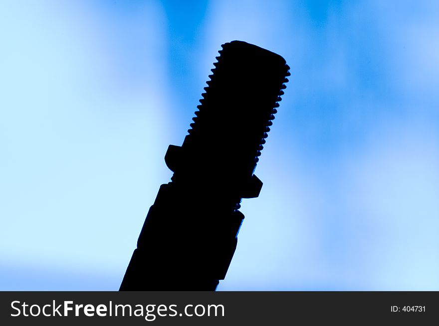 Silhouette of a cable connection against a blue gradient background. Good technology concept photo. Silhouette of a cable connection against a blue gradient background. Good technology concept photo.