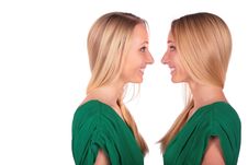 Twin Girls Smiling Face-to-face Stock Images